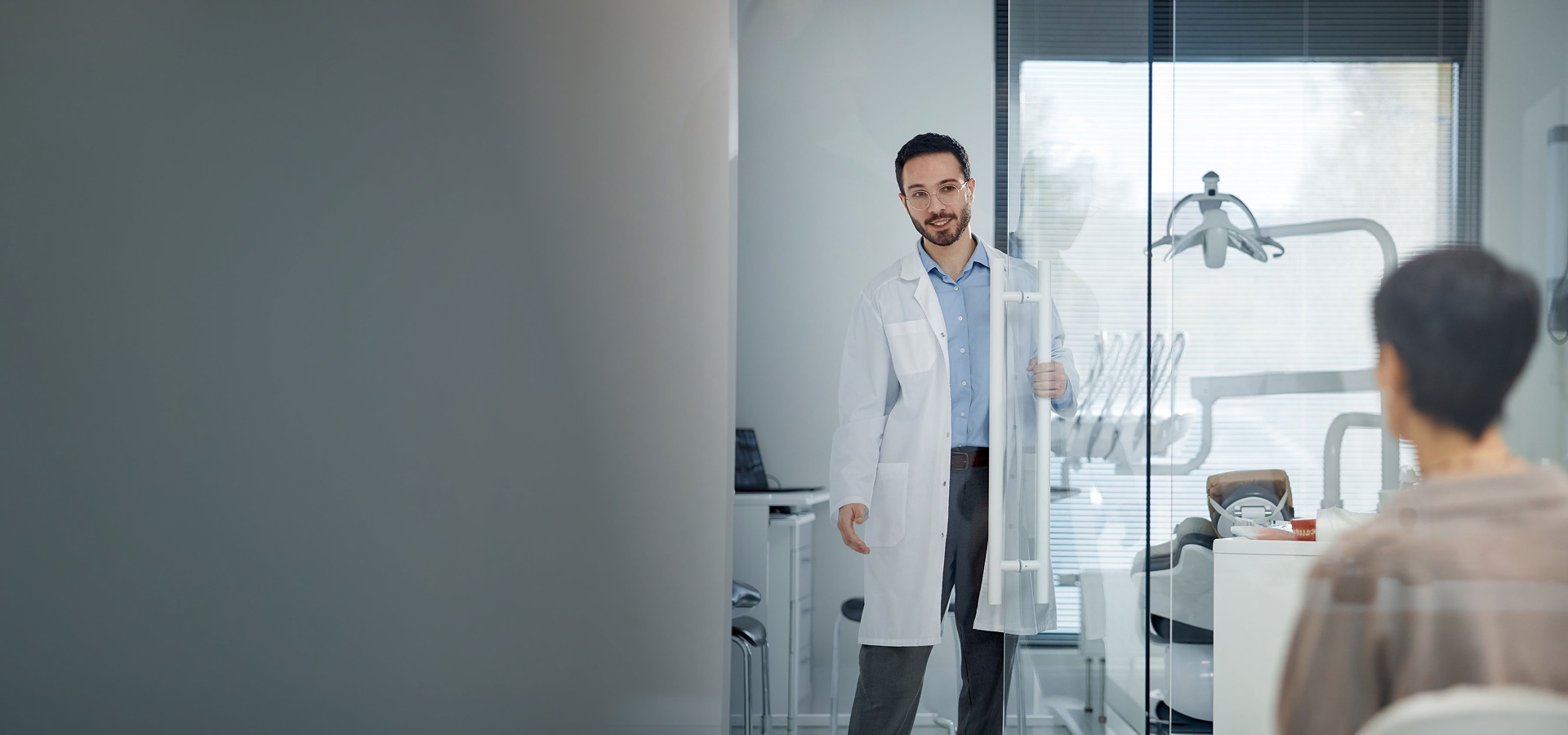Doctor talking patient dental clinic