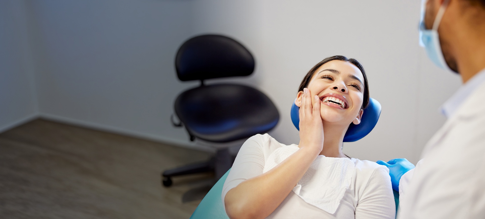 Patient and dentist talking about treatment