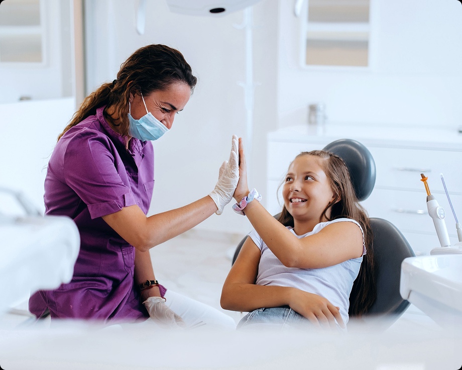 Patient dentist doing hi five