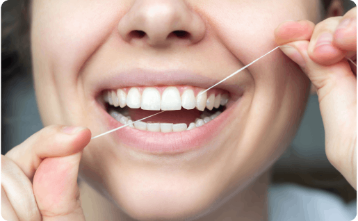 Woman using dental floss
