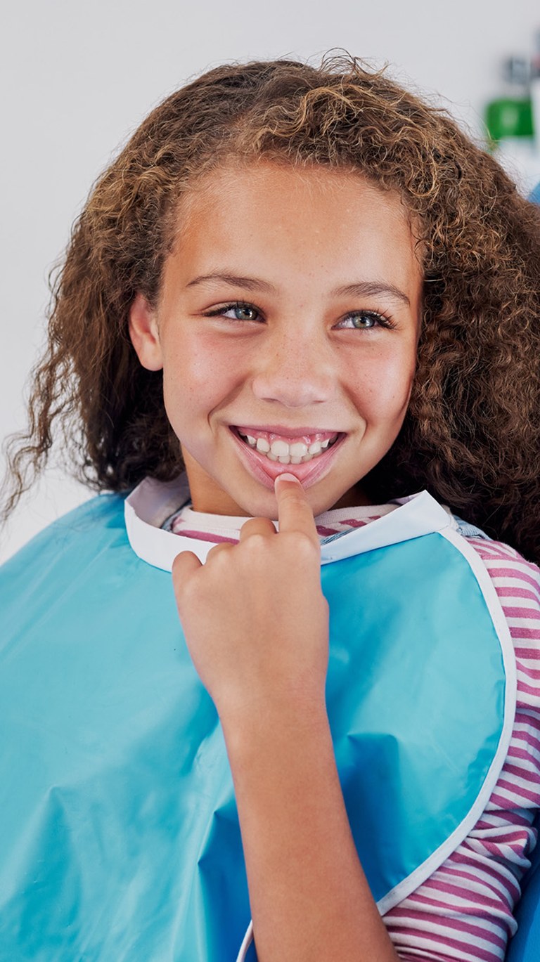 Young girl and dentist talking