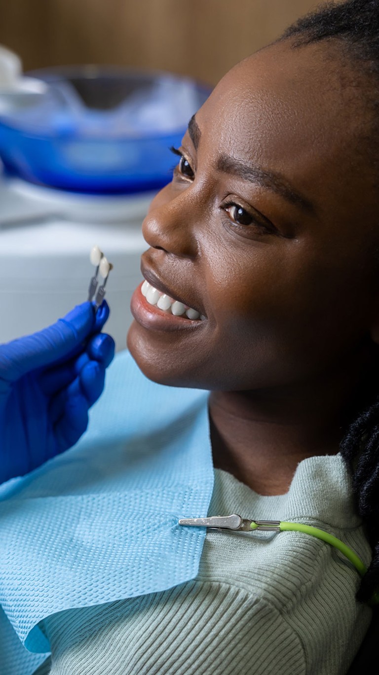 Young woman smiling at dental clinic